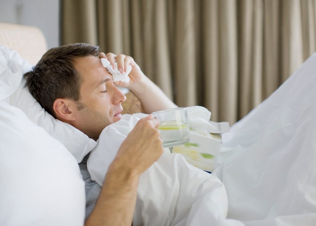 sick man in bed