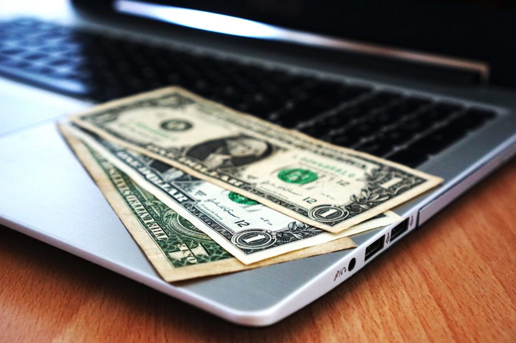 money on laptop