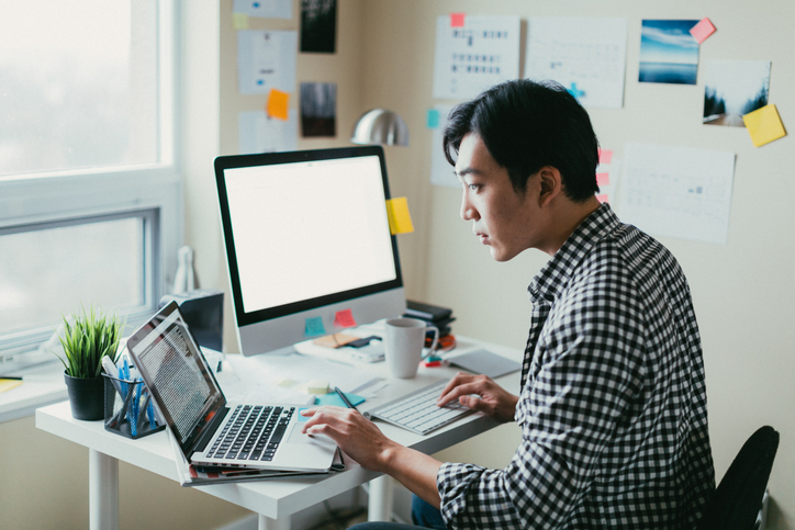 man multitasking and focusing on his work