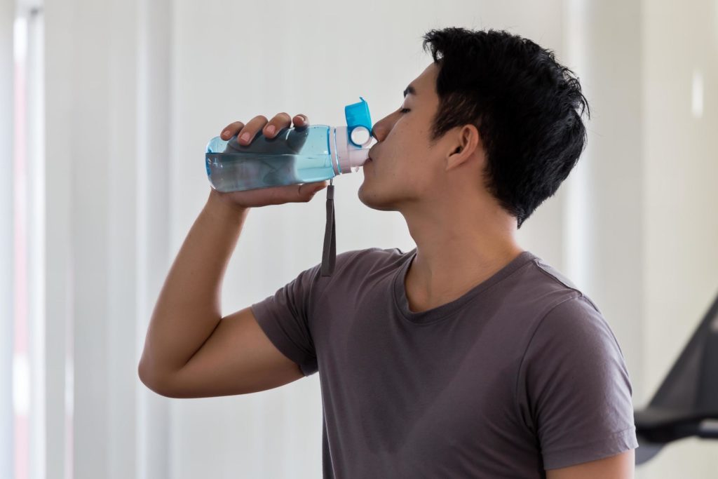 man drinking water
