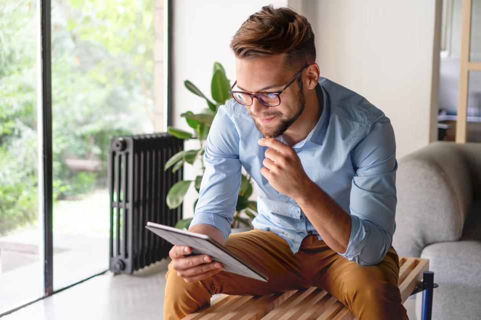 Man looking at iPad 