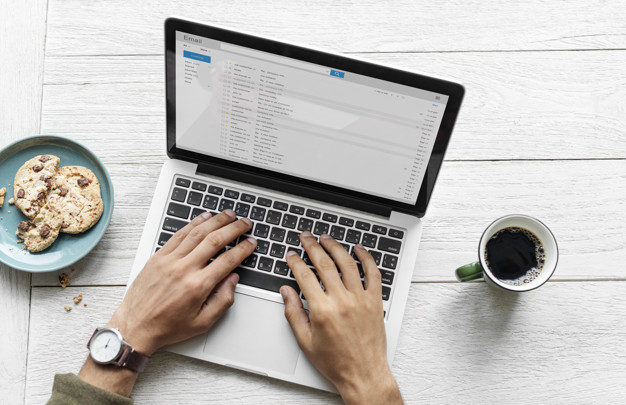 man using email with computer