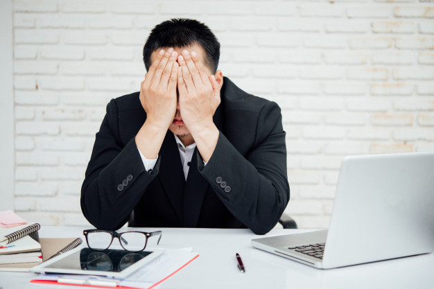 businessman losing self-confidence
