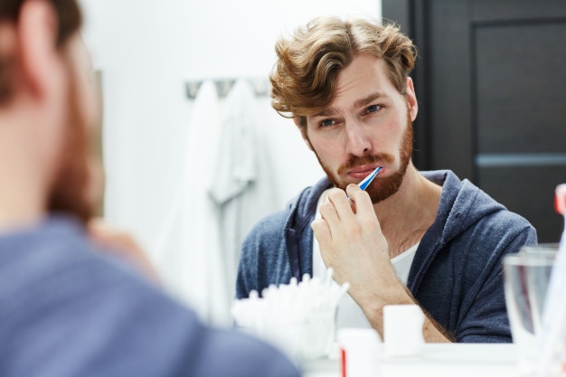 man Cleaning teeth