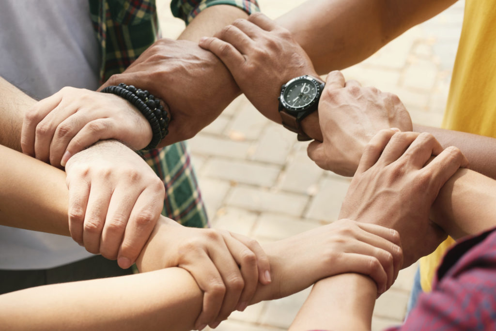 people holding each others wrists
