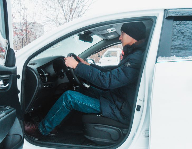 man adjusting driving seat