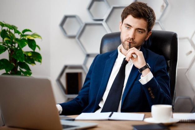 man sitting at workplace,