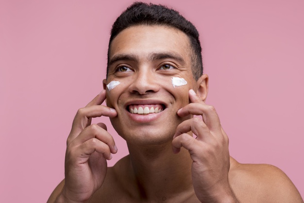 man using facial products