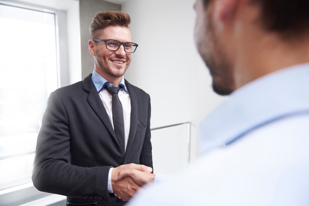 Business people shaking hands in agreement