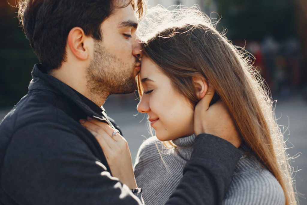 Beautiful couple spend time in a summer city