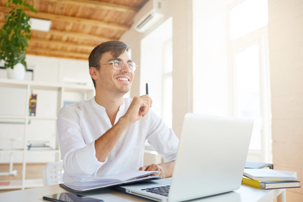 happy pensive young businessman wears white shirt at the office