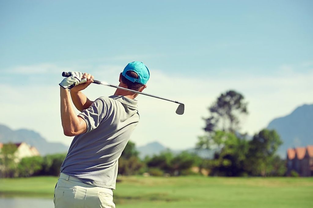 a golfer swinging a shot