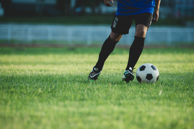 healthy lifestyle- man playing football