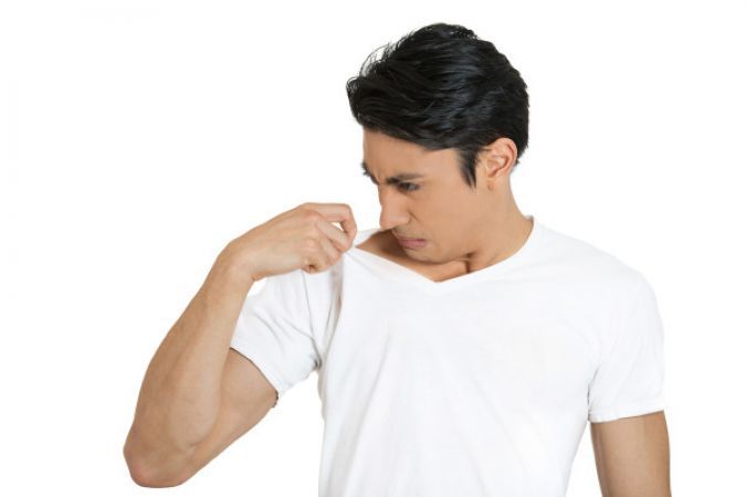 man smelling his body smell