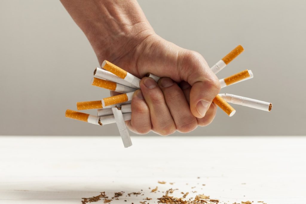 hand holding Cigarettes
