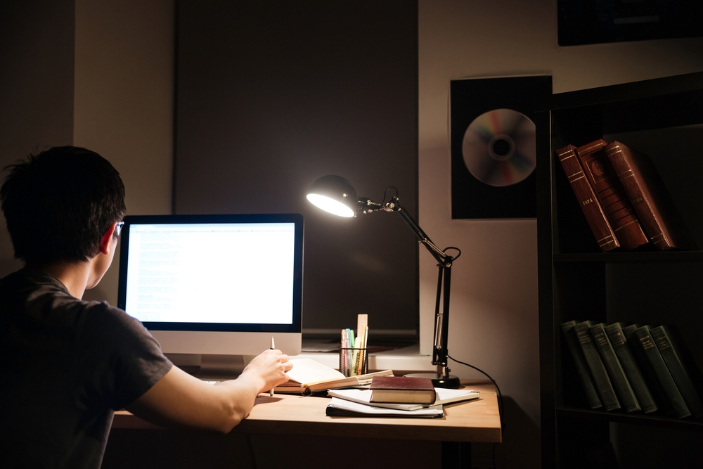 man looking at laptop