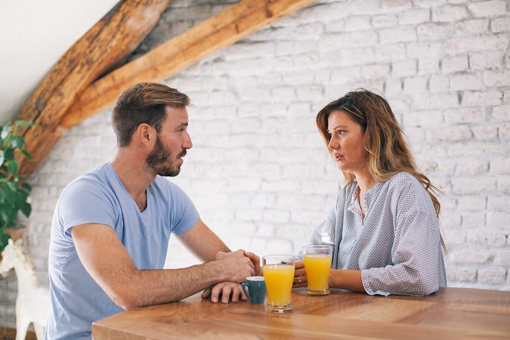 Young woman and man talking