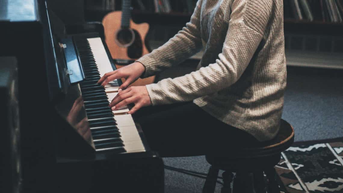 man playing classical piano recital