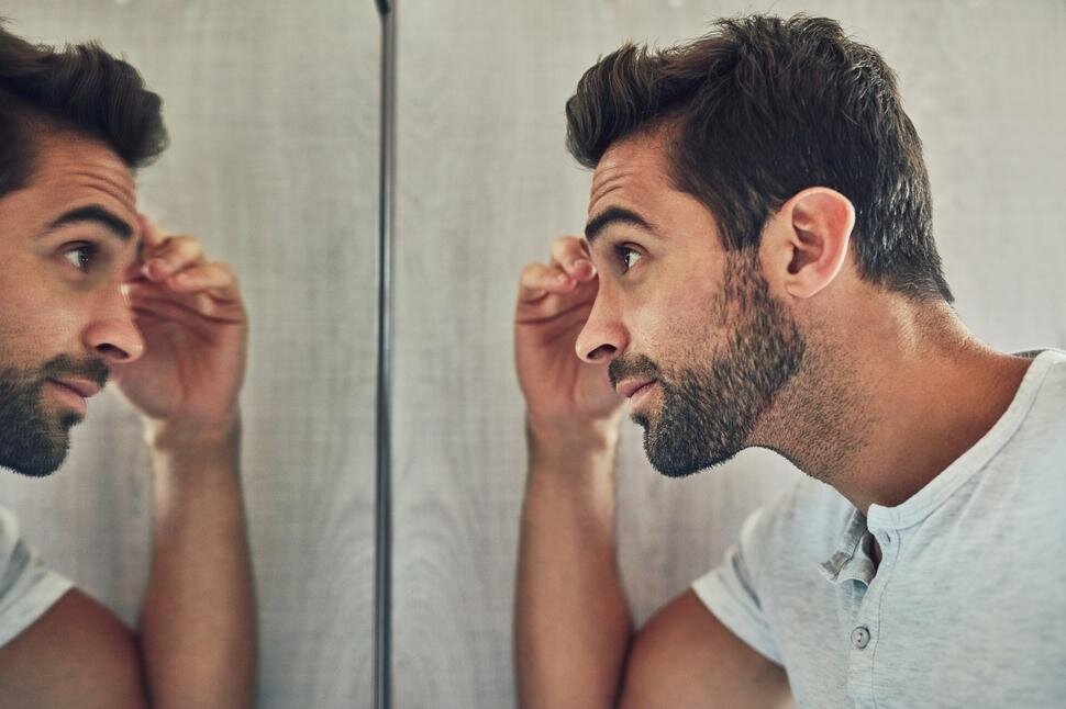 man looking at the mirror; style