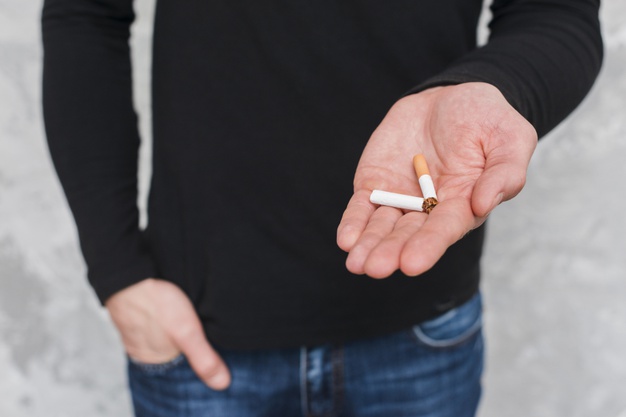 broken cigarette in hand 