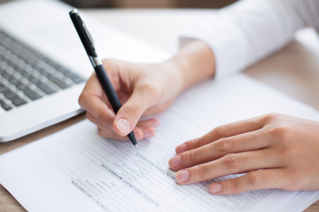 business person completing form
