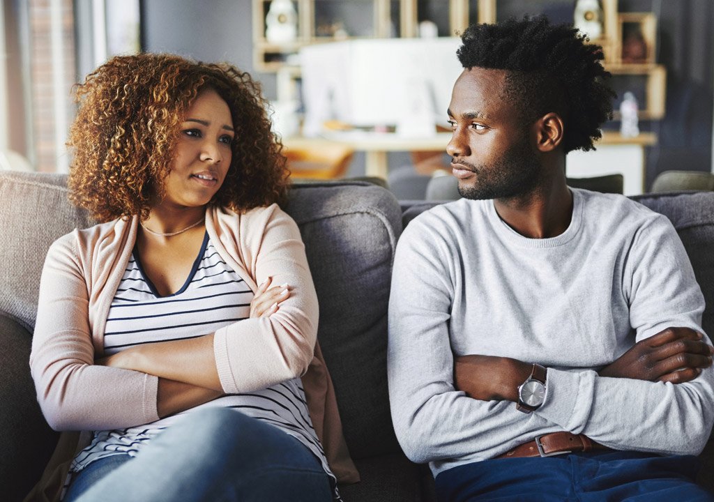 Unhappy woman talking to her boyfriend