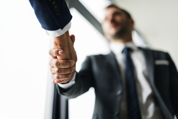 Handshake business men concept