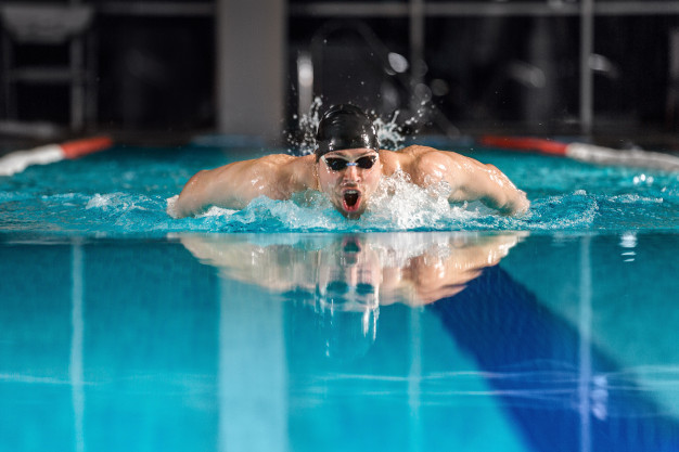 Male swimmer swimming the butterfly