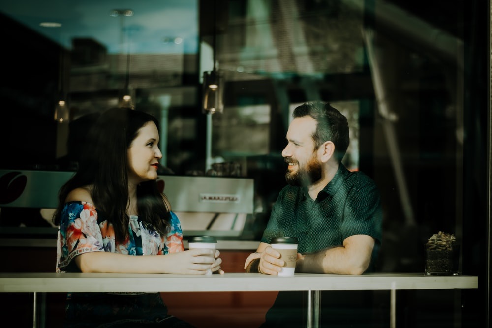 Happy couple enjoying a coffee at the coffee shop
