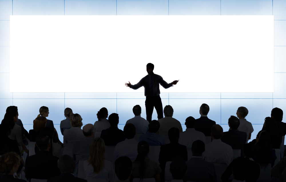 Man Speaking On Stage