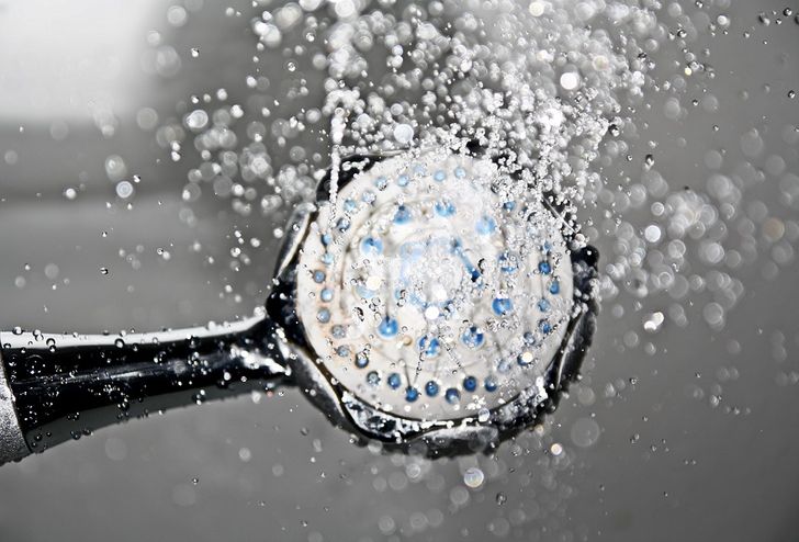 man taking a cold shower before bed
