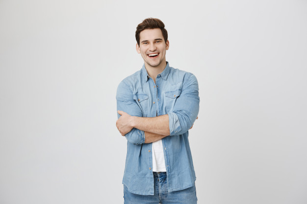 Attractive laughing guy having fun, smiling happy