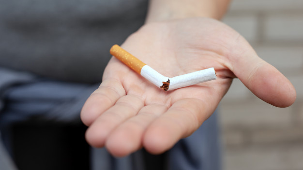 broken-cigarette-hand-stop-smoking-concept-nicotine-addiction