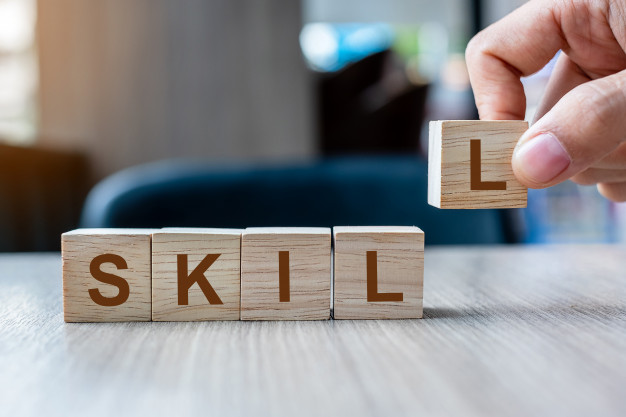 businessman-hand-holding-wooden-cube-block-with-skill-business-word-ability-learn-knowledge-technical-professional-experience-concepts