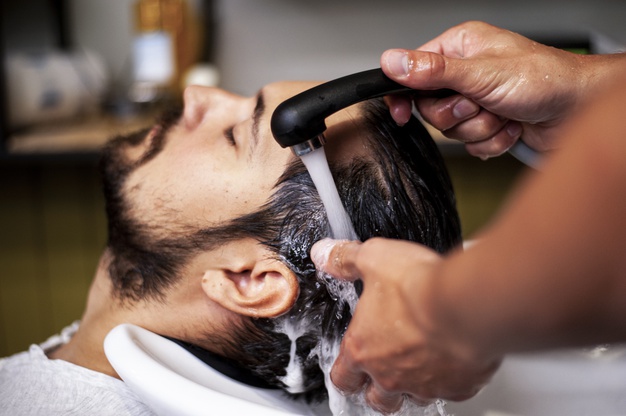 man getting a hair wash 