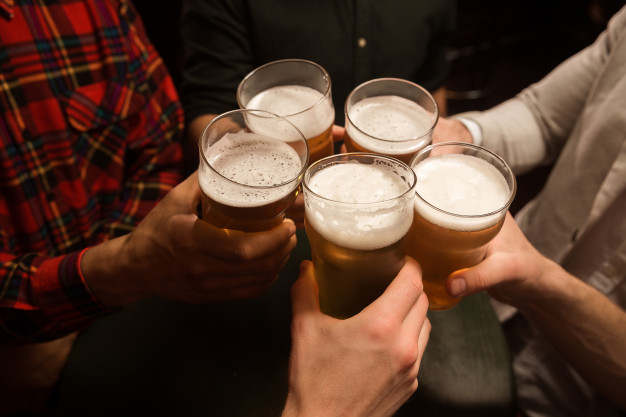 men toasting with beer 