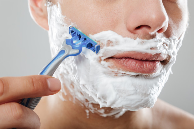 close-up-portrait-serious-man-with-shaving-foam