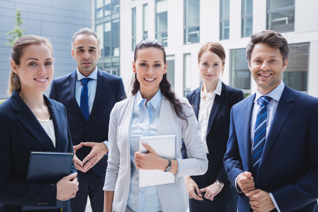 businesspeople-standing-outside-office-building