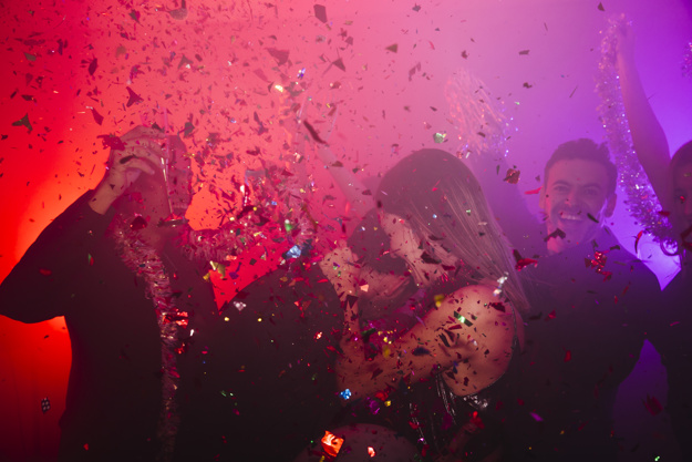 Dancing couple celebrating in club
