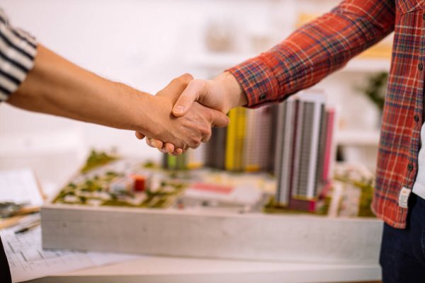 colleagues shake hand; successful lifestyle