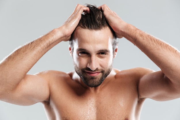 handsome man touching hair