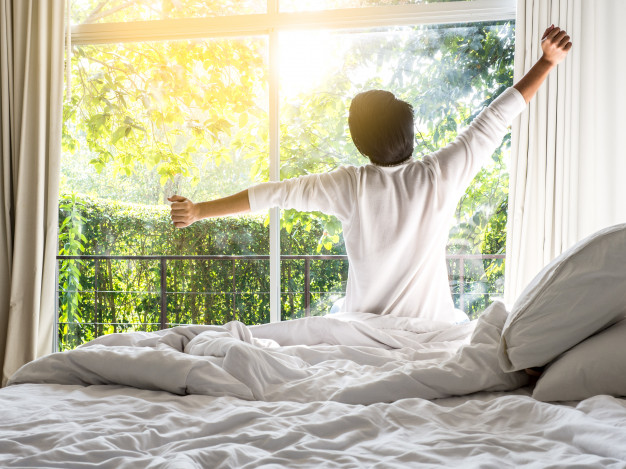 lazy-man-happy-waking-up-bed-rising-hands-morning-with-fresh-feeling