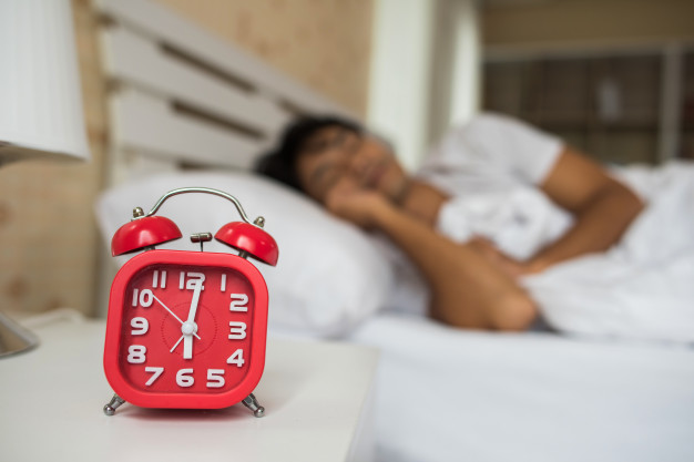  man waking up in his bedroom 