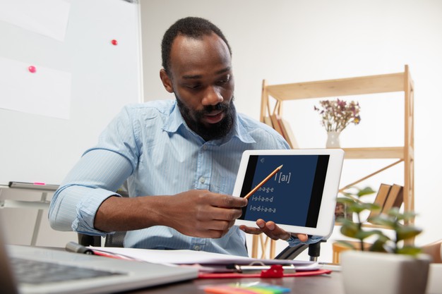 man teaching English online