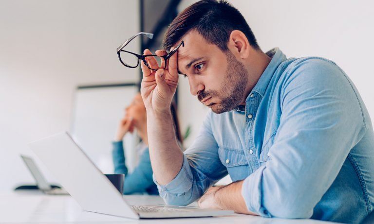 sad man sitting in the office