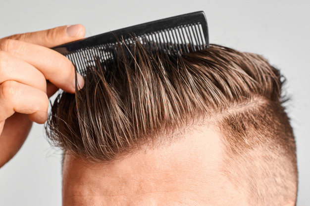 man combing