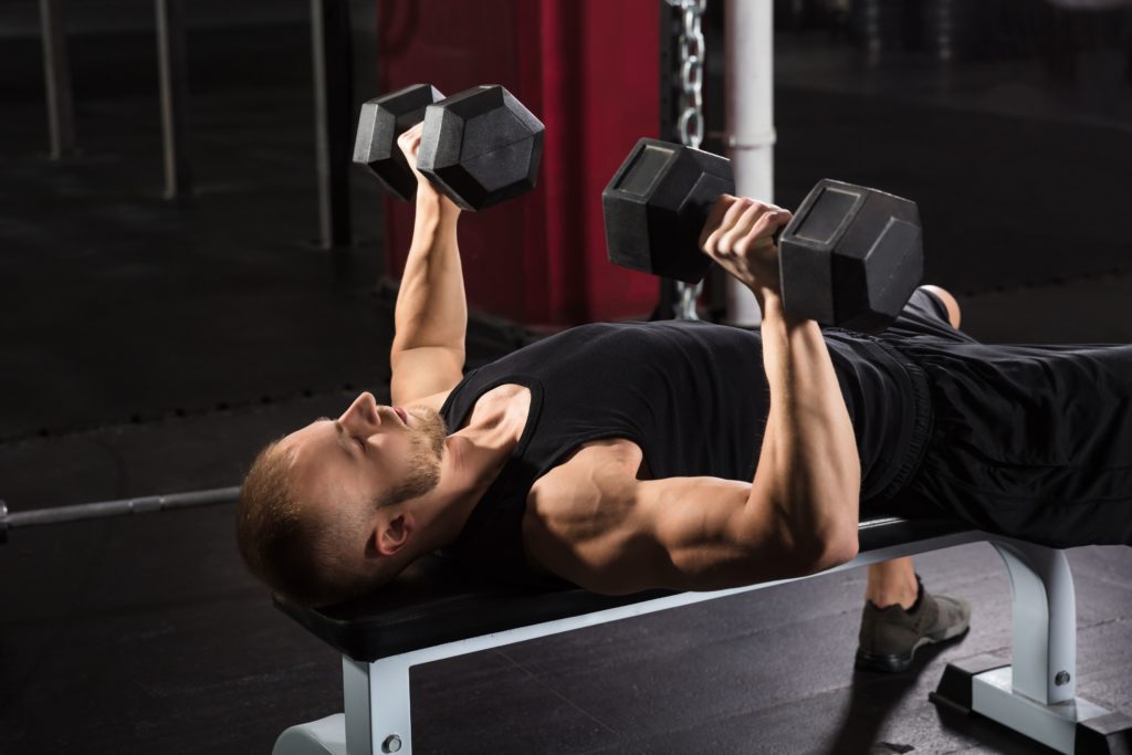 man-exercising-with-dumbbell-royalty-free