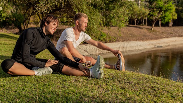man-girl-doing-warm-up-park