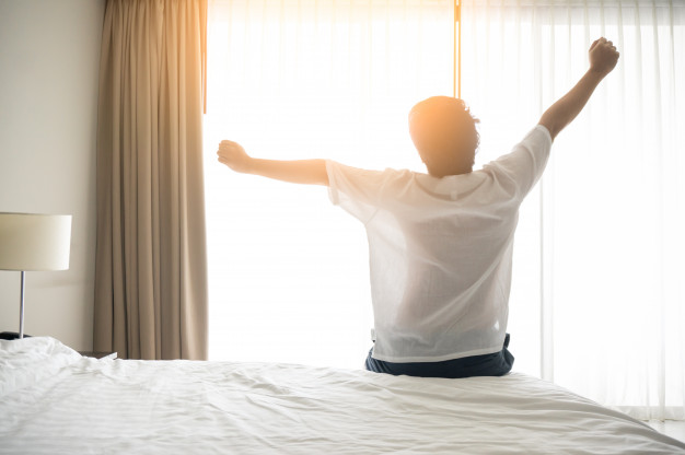 man wake up early morning