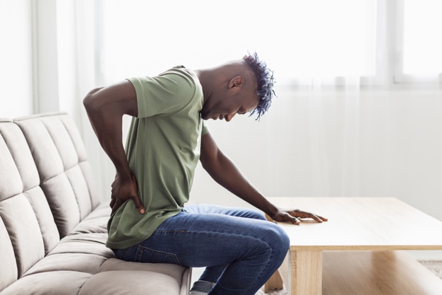 man suffering back pain
